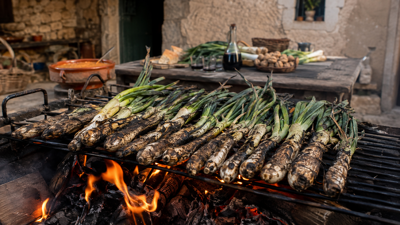 calcots-economia-local-cataluna Calçots cocinándose al fuego durante una calçotada tradicional en Cataluña.